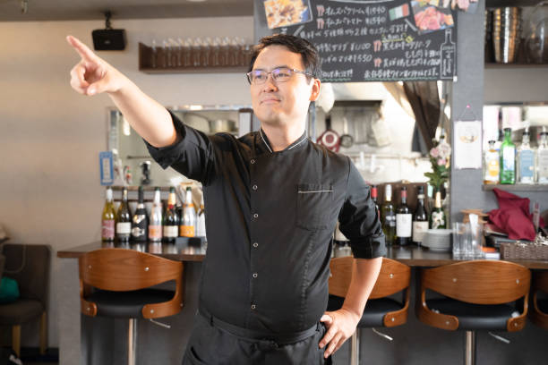 istock A man who runs a restaurant pointing to a point 1371516714
