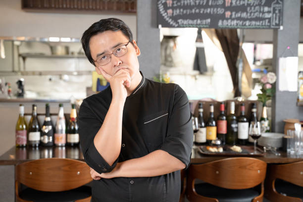 A man who runs a restaurant who is in trouble and depressed