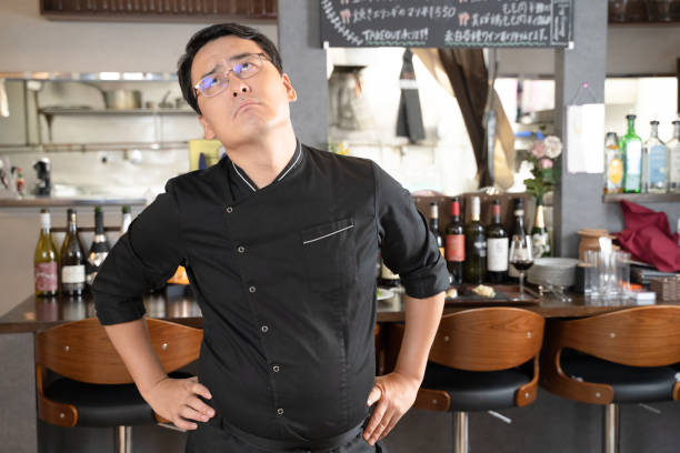istock A man who runs a restaurant who is in trouble and depressed 1371516741