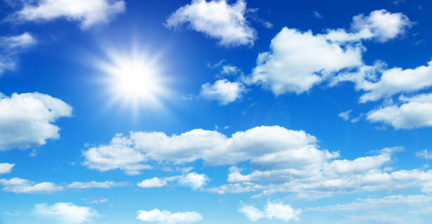 istock Sunny day background, blue sky with white cumulus clouds 1371518515