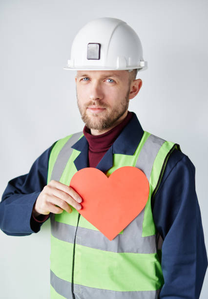 istock Labour Day theme: male worker in hard hat and reflective vest 1371522381
