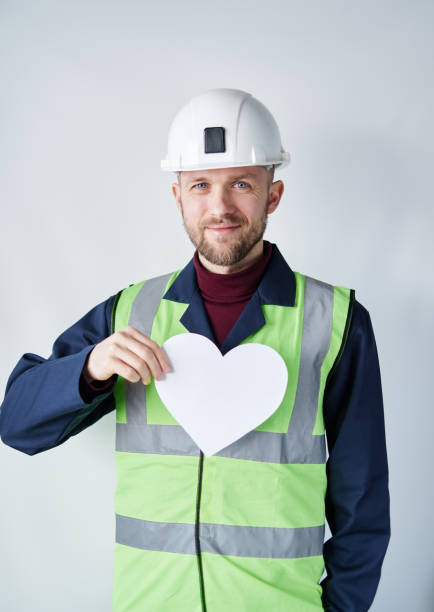 istock 1st of May concept: worker in helmet and reflective vest 1371522484