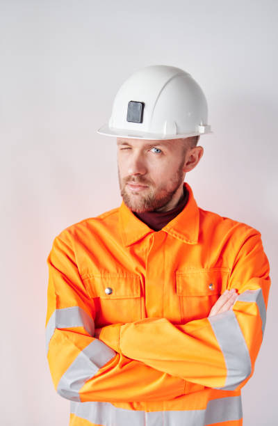 istock Construction site manager standing with folded arms in helmet 1371522732