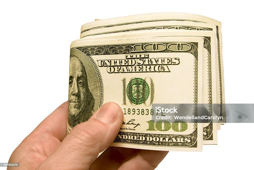 Сложенный деньги в руке - Стоковые фото 100 роялти-фри