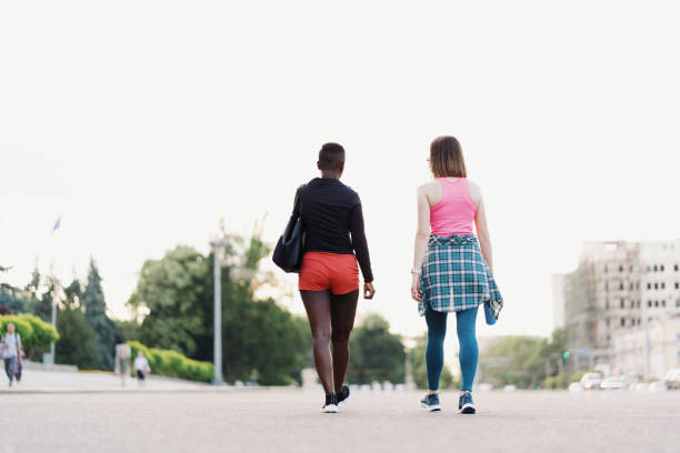 istock Two multiethnic girls walking for a exercise session, outdoor communicating. 1371526510