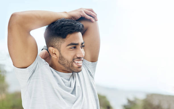 istock Shot of a handsome young man stretching outside 1371526650
