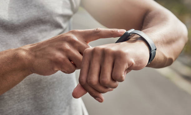 istock Cropped shot of a man checking his watch while out for a run 1371526675