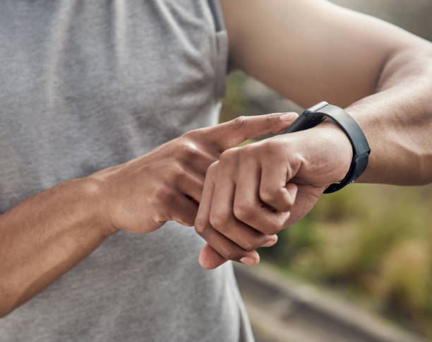 istock Cropped shot of a man checking his watch while out for a run 1371526681