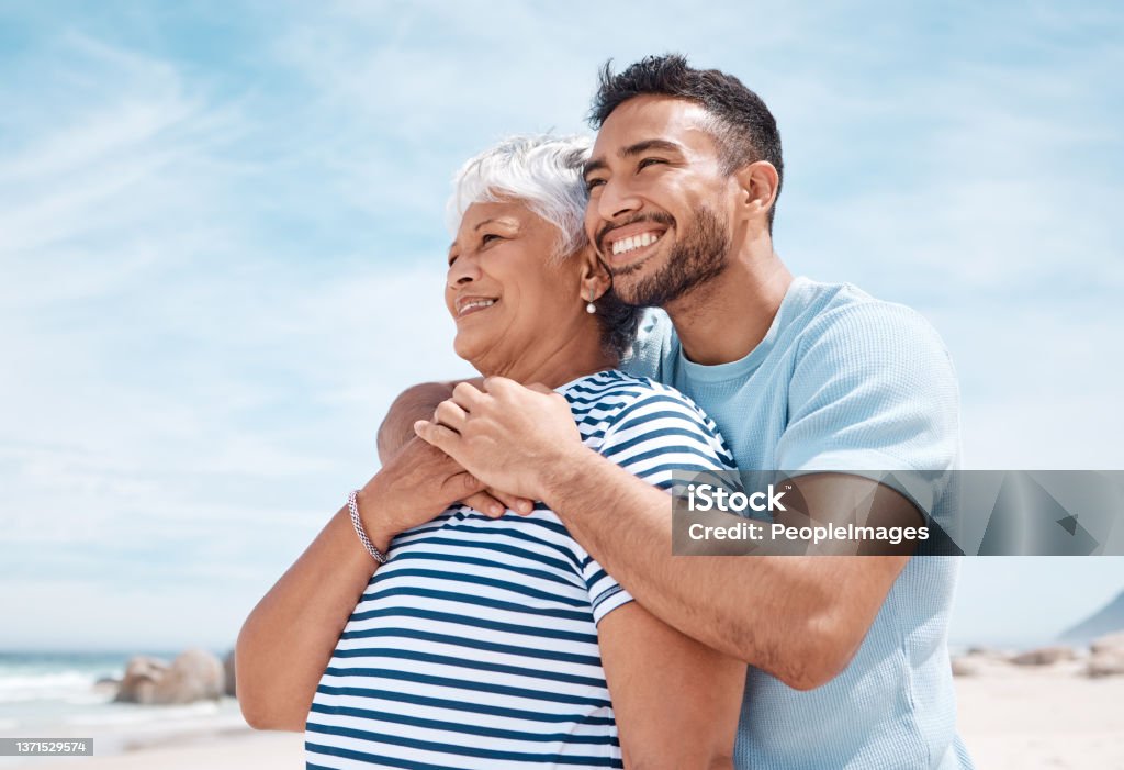 Shot of a young man spending the day at the beach with his elderly mother I will love you forever and a day Mother Stock Photo