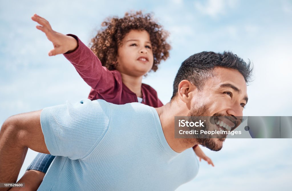 Shot of a man spending time at the beach with his son Feeling as free as a bird Father Stock Photo
