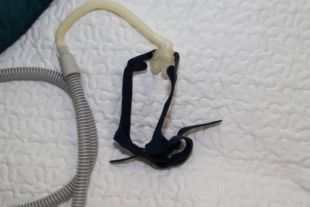 istock Full Face CPAP Mask with Headgear On A Bed 1371534324