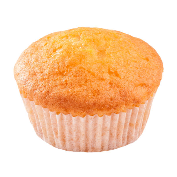 istock Soft and moist muffin in paper baking cup isolated on white 1371535485