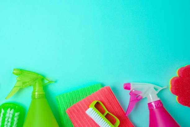 istock Spring cleaning concept with supplies on blue background. Top view with copy space 1371538132