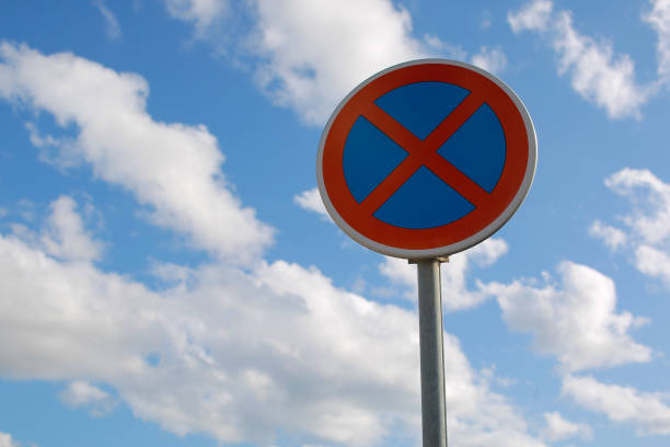 no parking traffic road sign. the urban clearway sign with blue sky cloudy background. - main course imagens e fotografias de stock