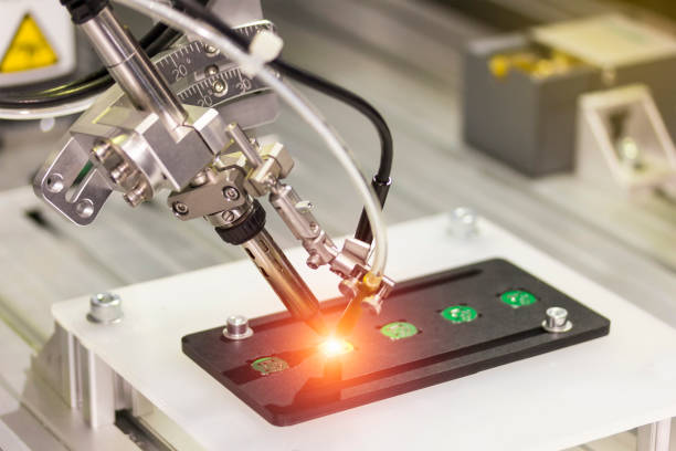 istock automation system robotic point soldering for assembly electric circuit board (PCB) in industrial 1371541833