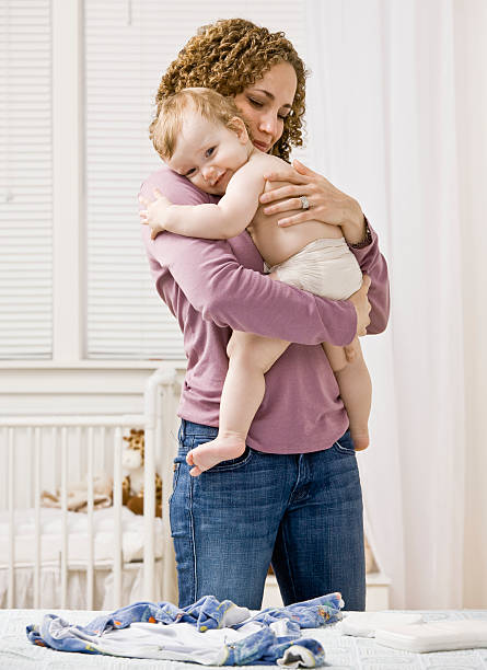 istock Devoted mother hugging and comforting her son in bedroom 137154252