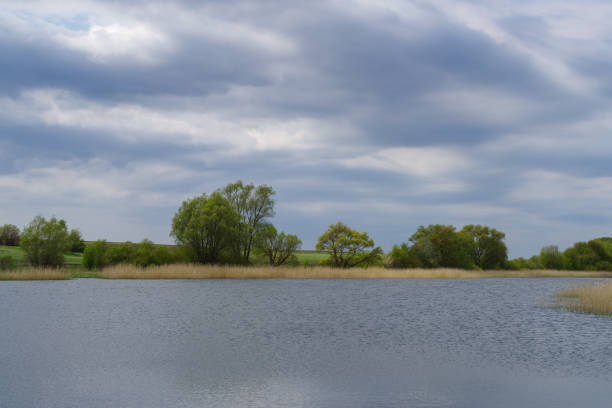 istock Scenic view of pond against sky 1371543448