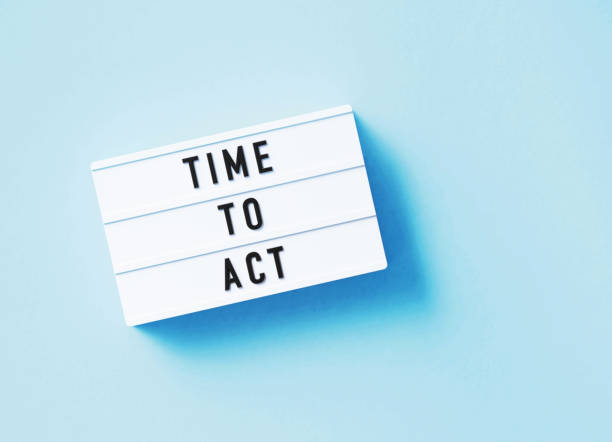istock Time To Act Written White Lightbox Sitting On Blue Background 1371547953