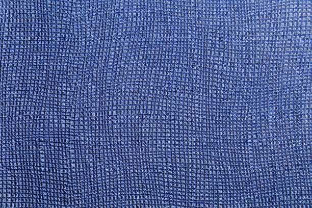 Close-up of light blue wallpaper texture background.