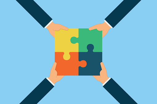 Teamwork Concept. Working Together. Pieces Of Jigsaw Puzzle