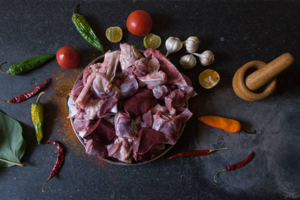istock Fresh raw meat and ingredients on a dark background. 1371549342