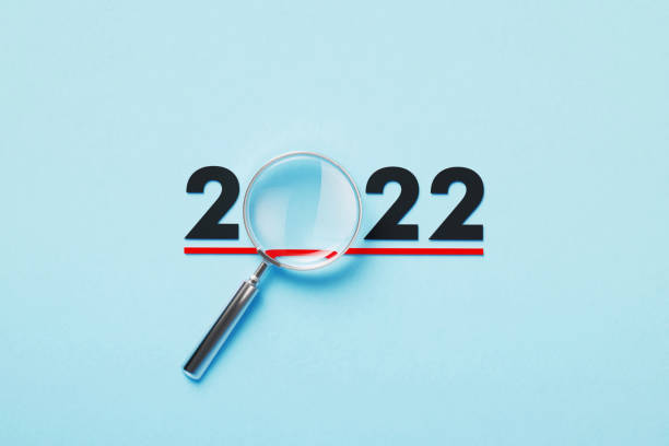 Magnifier Forming 2022 On Blue Background Magnifier forming 2022 on blue background. Horizontal composition with copy space. 2022 stock pictures, royalty-free photos & images