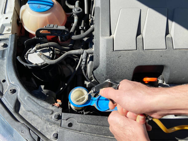 istock Filling the car windshield wiper fluid 1371550538
