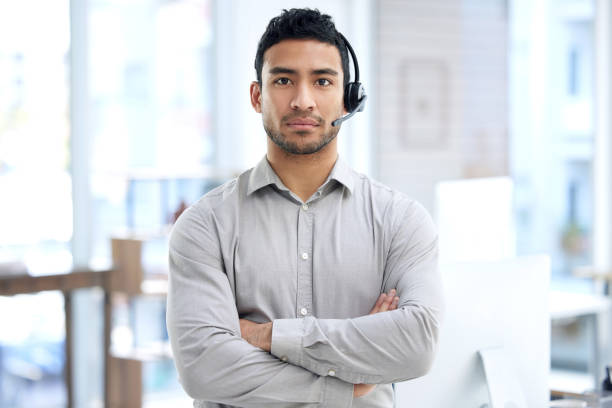 istock Portrait of a young businessman using a headset in a modern office 1371553739