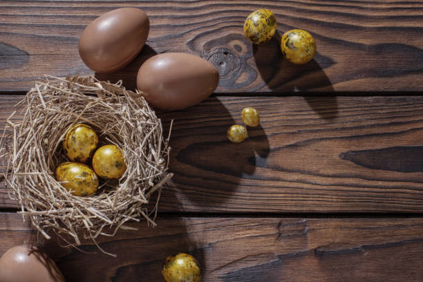 istock golden and chocolate easter eggs on dark wooden background 1371553815