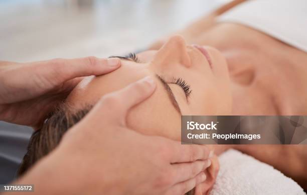 Closeup Shot Of A Mature Woman Enjoying A Relaxing Head Massage At A Spa Stock Photo - Download Image Now