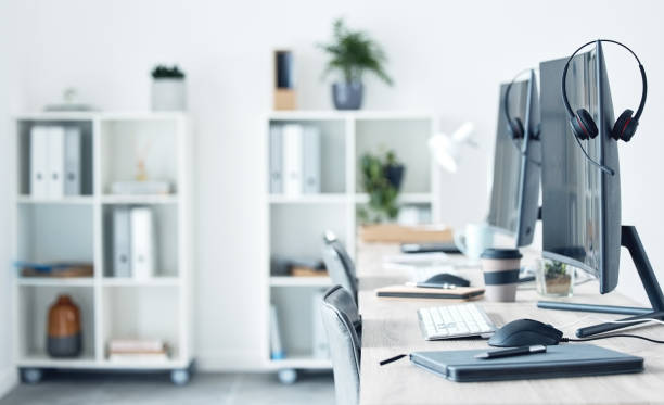 istock Shot of a workspace in a call centre 1371555765