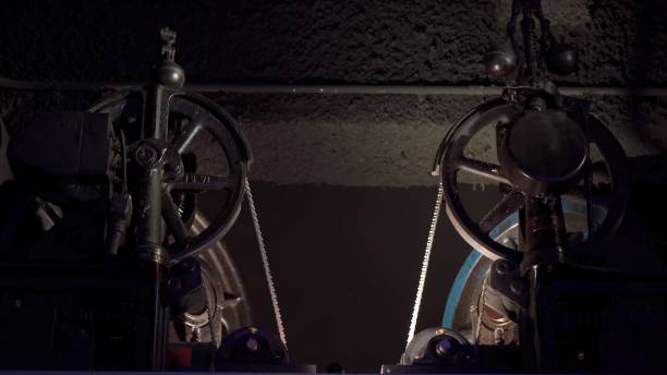Old electrical mechanisms. Vintage historical elevator mechanisms. Rope and wheels.
