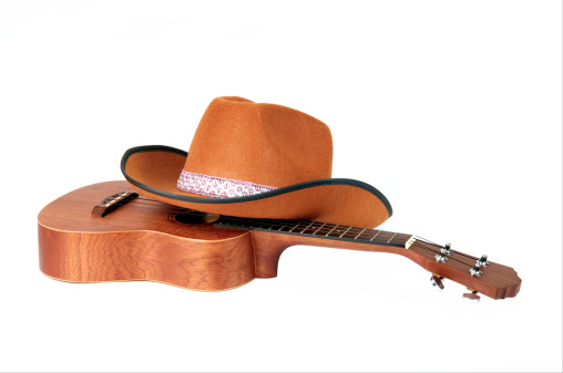 Guitar and Hat isolated on white
