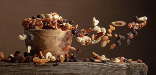 Flying dried fruits and nuts. stock photo