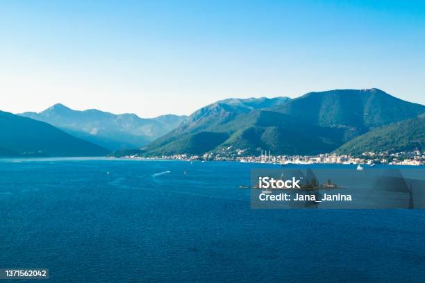 Small Our Lady Of Mercy Island And Porto Montenegro Marina At Background Located Near Tivat City And Vrmac Mountain Stock Photo - Download Image Now