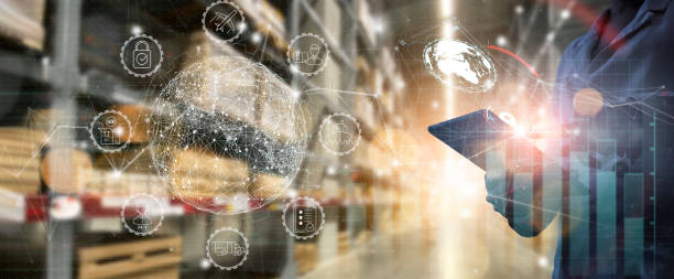 Business Workers using digital tablet computer cargo and tracking delivery for Transportation and global network of smart logistics in blur warehouse background. stock photo
