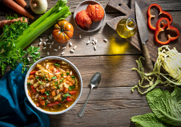 istock Vegetable Cabbage Soup vegan ingredients celery, beans, bell pepper, carrots, parsley and tomatoes 1371566638