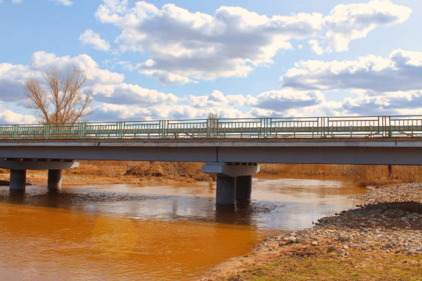 Reinforced concrete road bridge over the river. Close-up. Background.