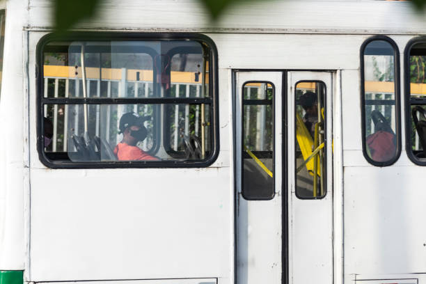 Salvador, Bahia, Brazil - October 30, 2020: People inside the bus wearing protective mask against coronavirus. Salvador, Bahia, Brazil.