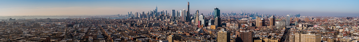 Remote aerial view on Manhattan Skyline over Brooklyn.