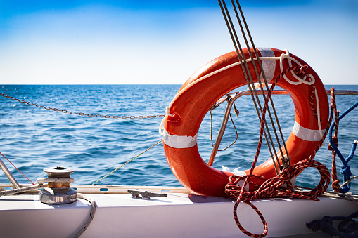 Fisherman at work with net on trawler fishing boat, typical small scale fisheries of the Mediterranean Sea