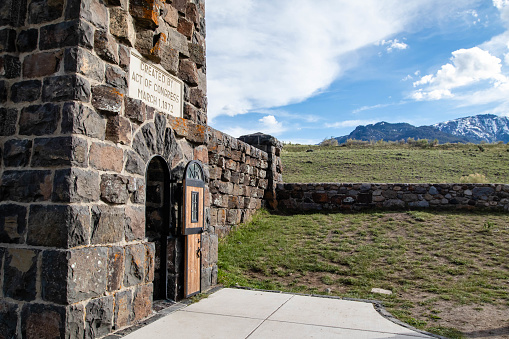 Gardiner, Montana, USA, May 27th, 2021: One of the walk through doors of the Historic Roosevelt Arch in Montana at the North Entrance of Yellowstone National Park