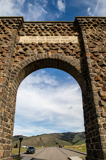 Gardiner, Montana, USA, May 27th, 2021 The Historic Roosevelt Arch in Montana at the North Entrance of Yellowstone National Park, vertical