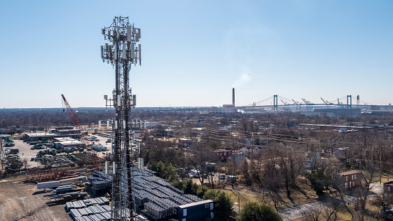 Telecommunication tower in Camden, New Jersey, with a remote view of the residential and industrial districts of Camden and Philadelphia in the backdrop.