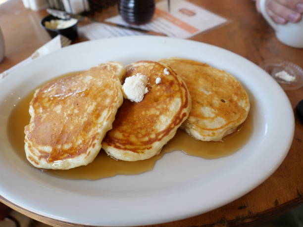istock Three Pancakes with syrup and butter 1371575449
