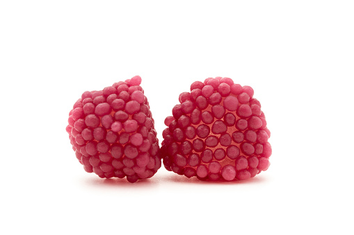 Berry of gelatin isolated on white background. Purple jelly raspberry candy.