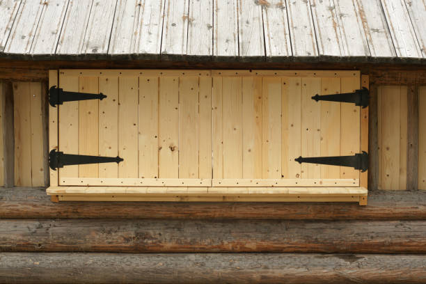 Closed wooden window shutters with iron hinges, for backgrounds and textures