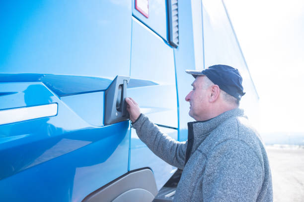 istock A truck driver gets into his truck 1371581925