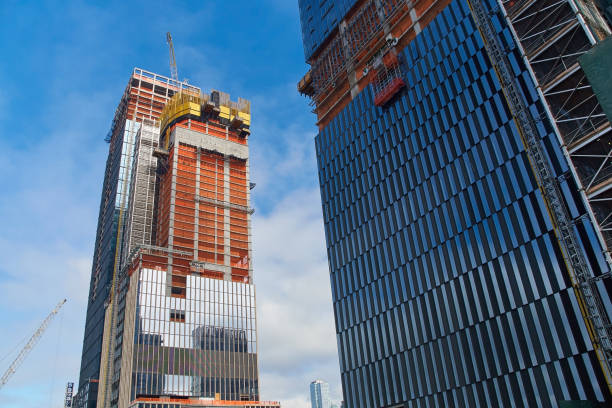 Skyscrapers under construction in New York city at daytime. stock photo