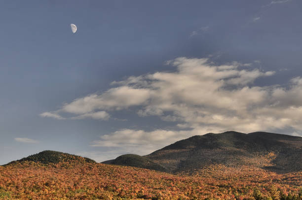 istock Half moon rising over Twin Mountain, New Hampshire 1371588353
